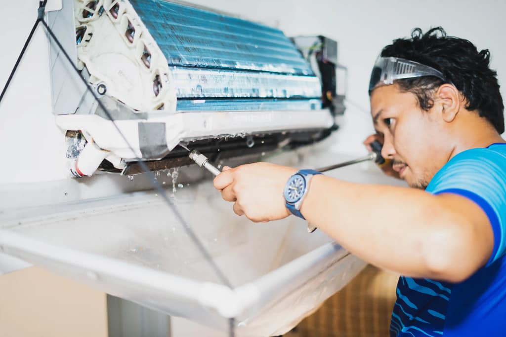 Technician doing AC Repair